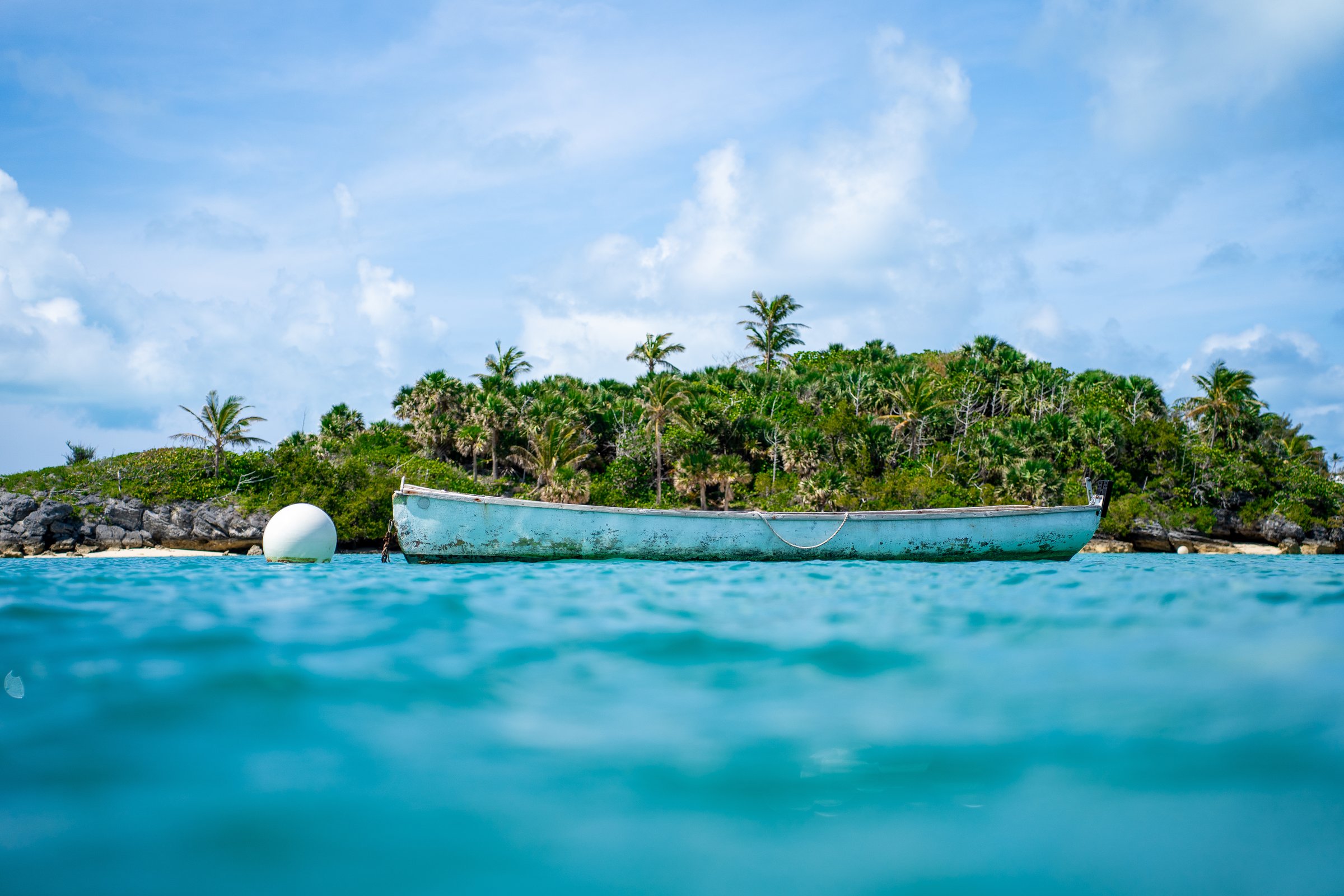 Old boat moored in turquoise Caribbean water